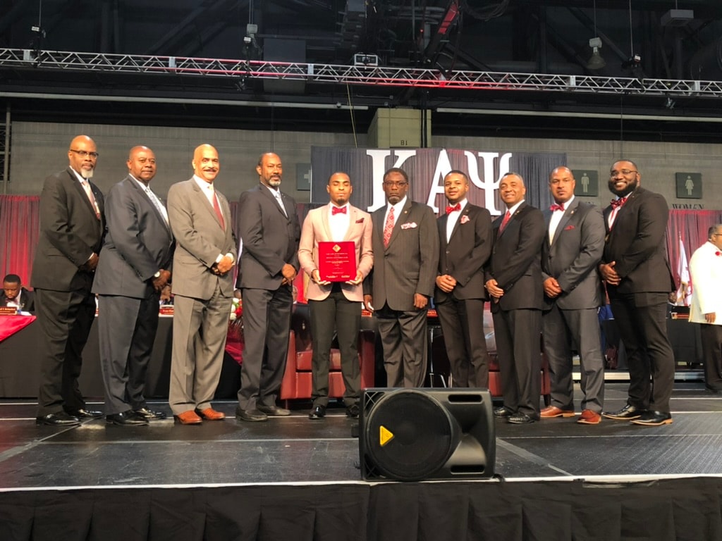 Brothers receiving award on stage at Grand Chapter